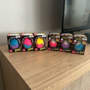 NEEDOH Magic Color Eggs & Chick Squeeze Toy Set - Blue, Pink, Yellow, Purple